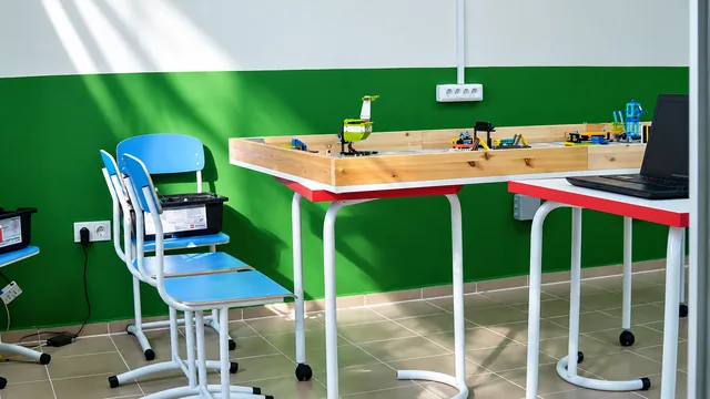 Completed interior: Robotics models on the shared worktable in the Zertte Studio laboratory